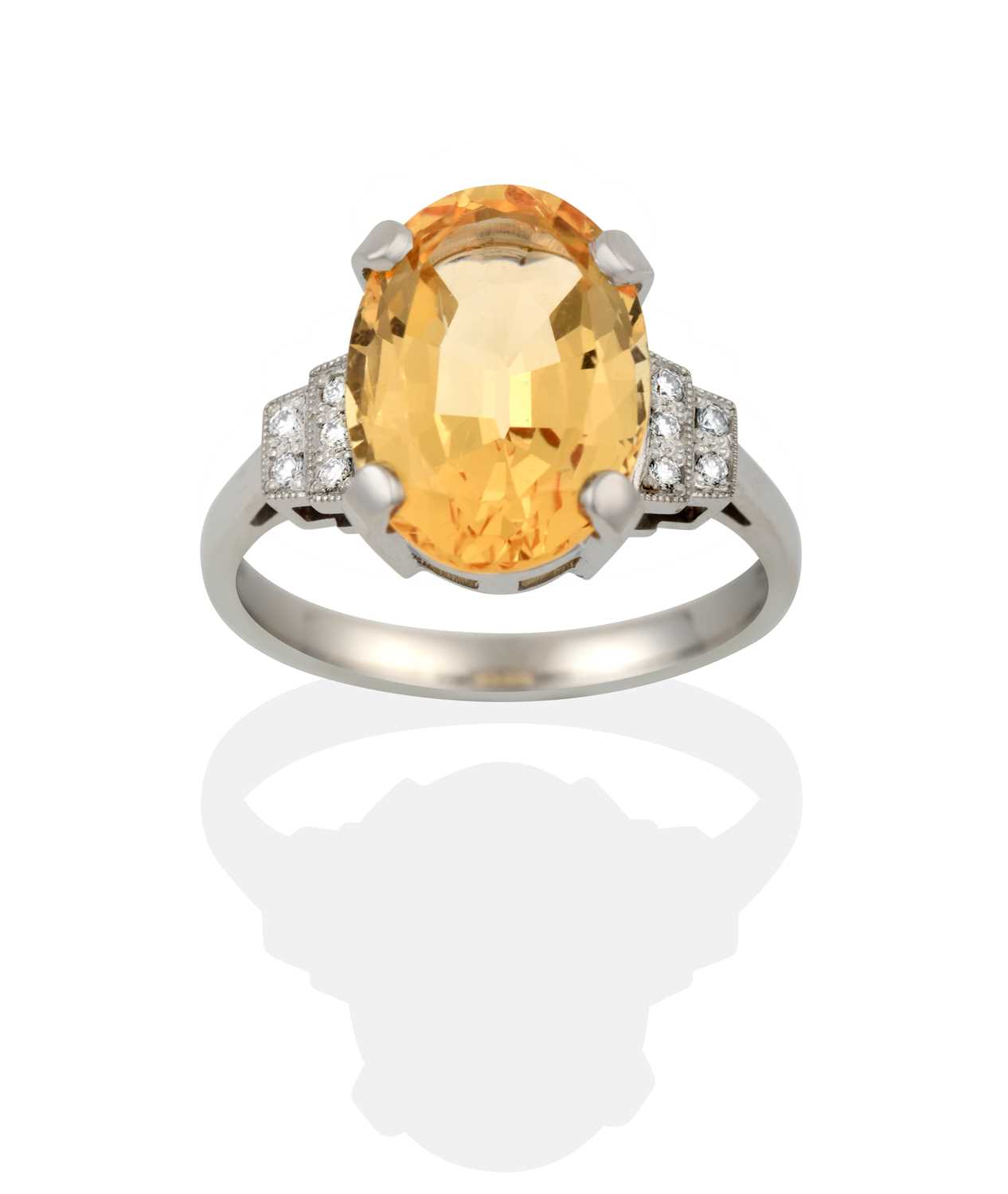 Lot 2356 - A Platinum Yellow Topaz and Diamond Ring