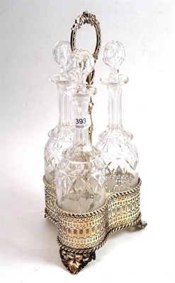 Lot 393 - A good silver plated three bottle decanter stand with pierced sides, with three cut and etched...