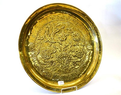 Lot 919 - A Keswick Home Industries Circular Brass Charger, designed by William Henry Mawson, repousse...