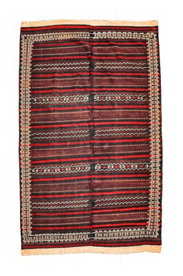 Lot 1133 - An Afghan Baluch Kilim, circa 1950, the pale...