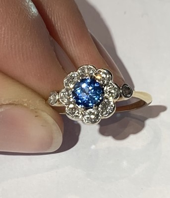 Lot 68 - A blue topaz and diamond cluster ring, stamped...