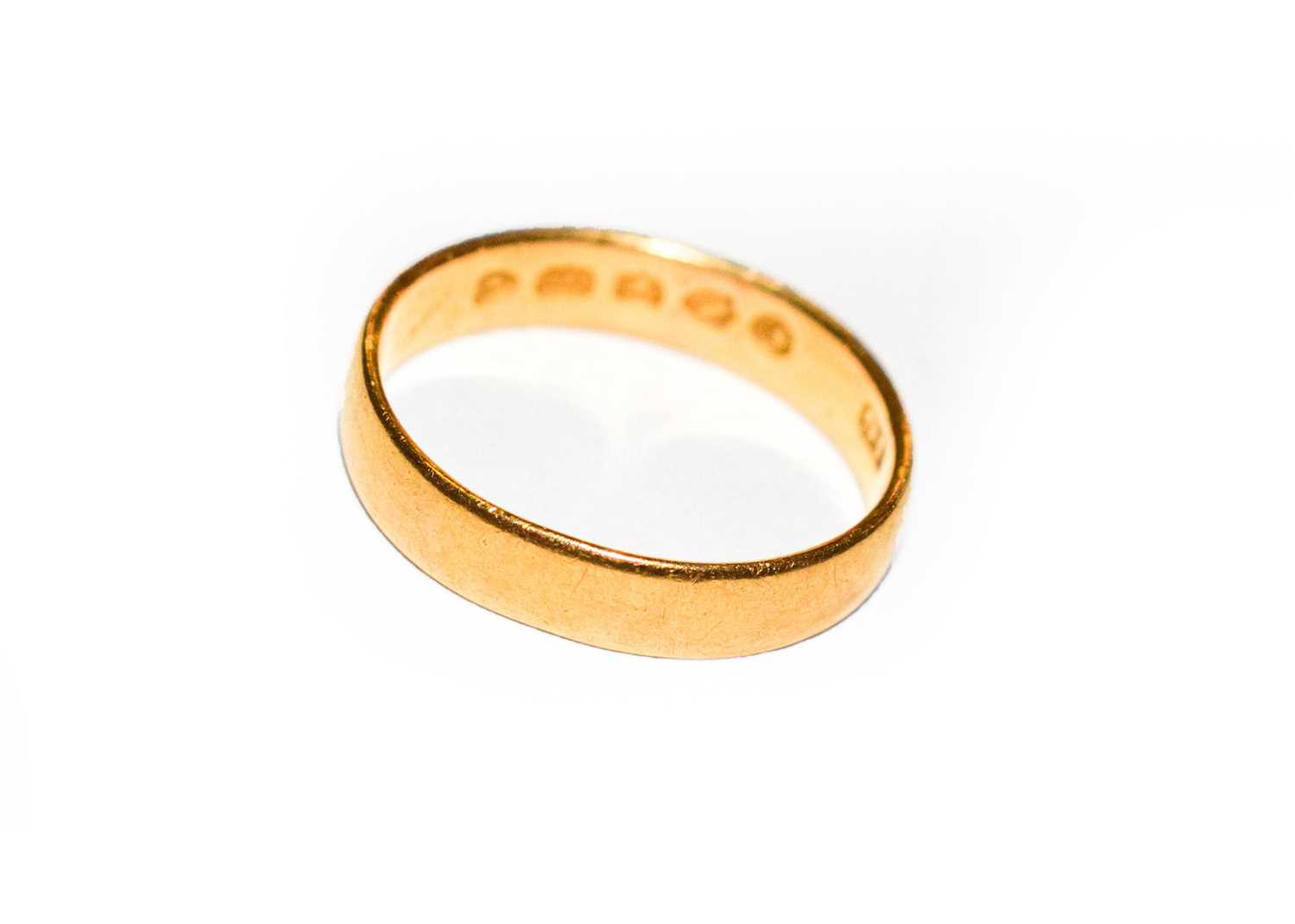 Lot 172 - A 22 carat gold band ring, out of shape