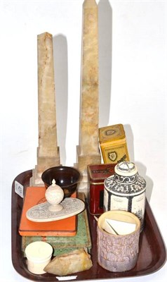 Lot 427 - A pierced and carved ivory cover, an ivory box circa 1920, advertising tins, a pair of obelisks etc