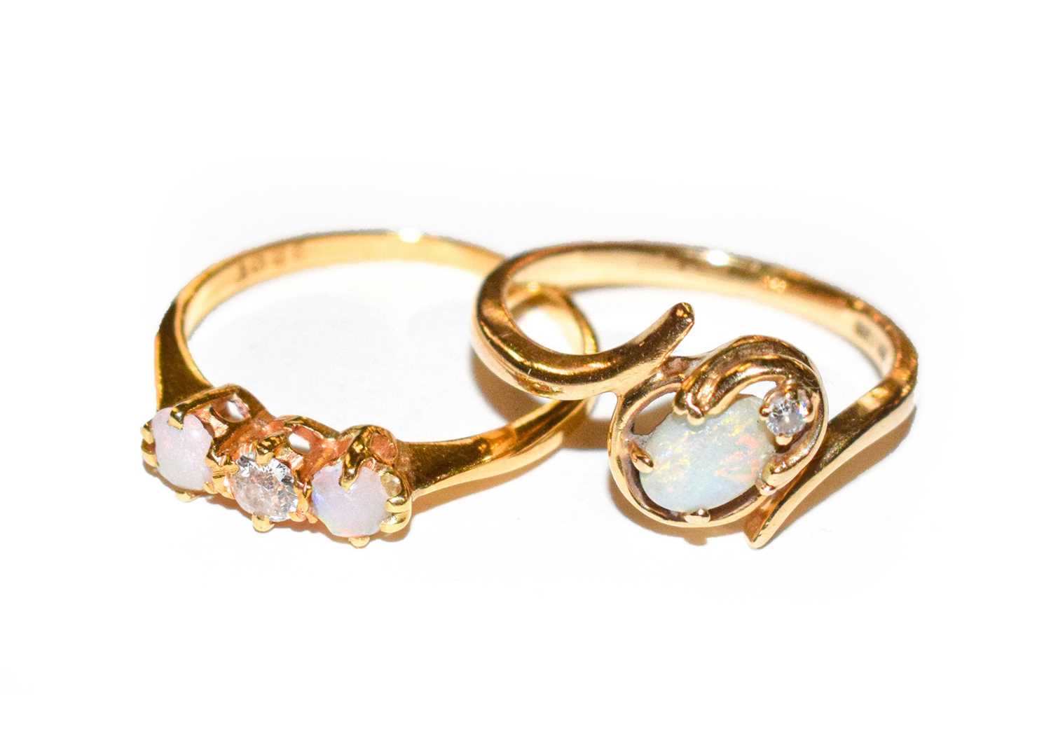 Lot 165 - An opal and diamond three stone ring, stamped...