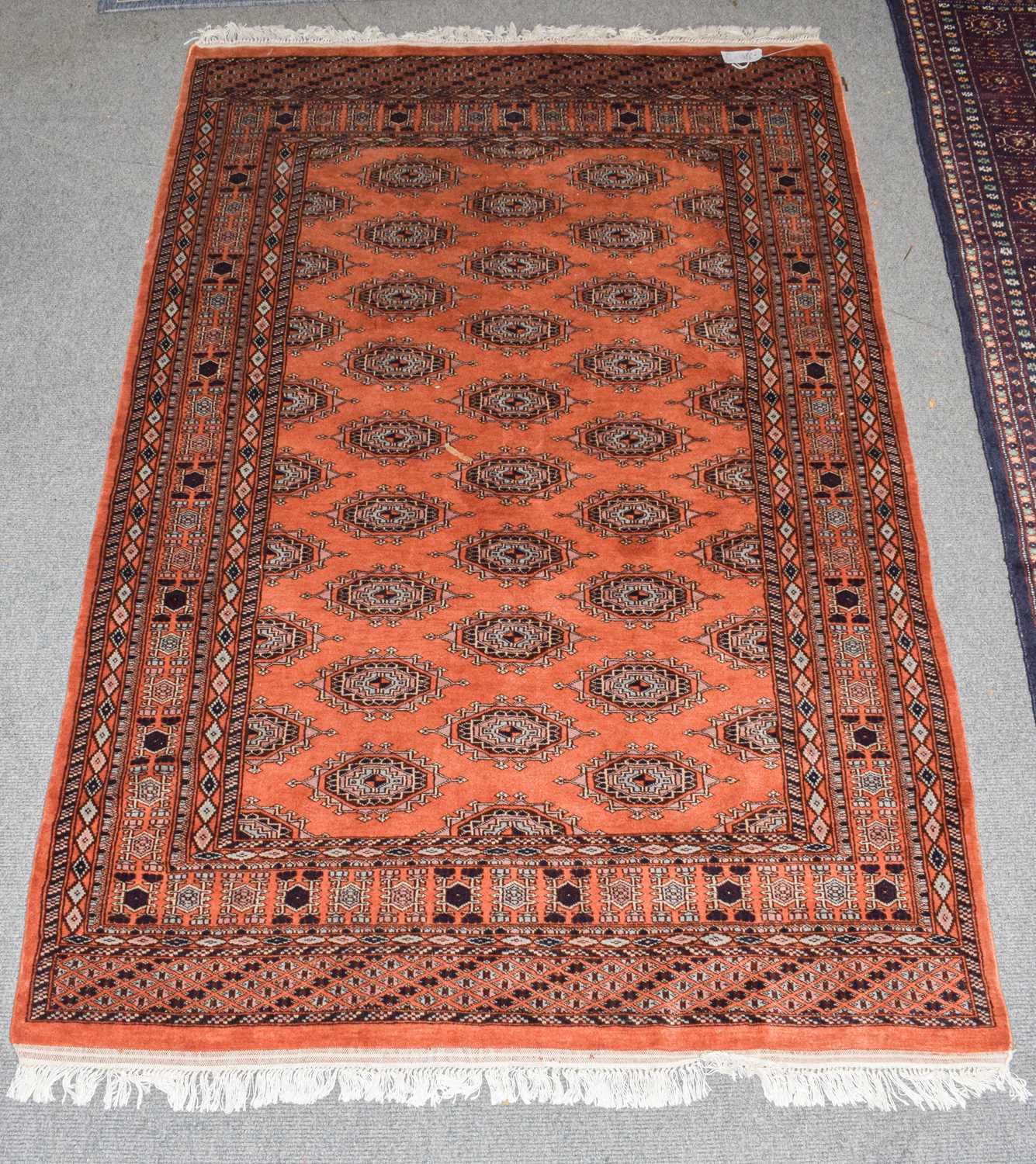 Lot 349 - Pakistani Bukhara rug, the terracotta field...