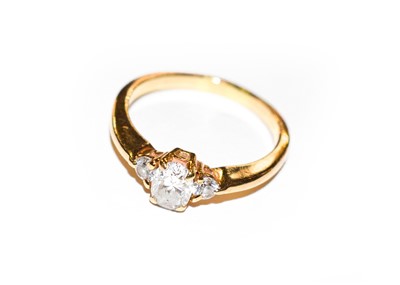Lot 107 - A diamond three stone ring, stamped ‘14K’,...