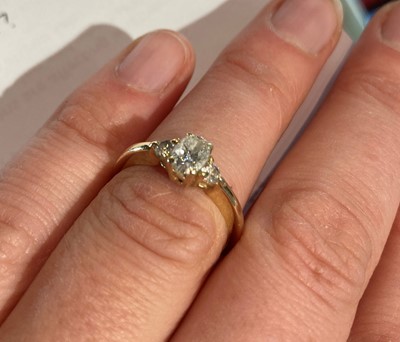 Lot 183 - A diamond three stone ring, stamped ‘14K’,...