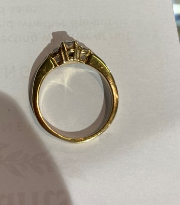 Lot 183 - A diamond three stone ring, stamped ‘14K’,...