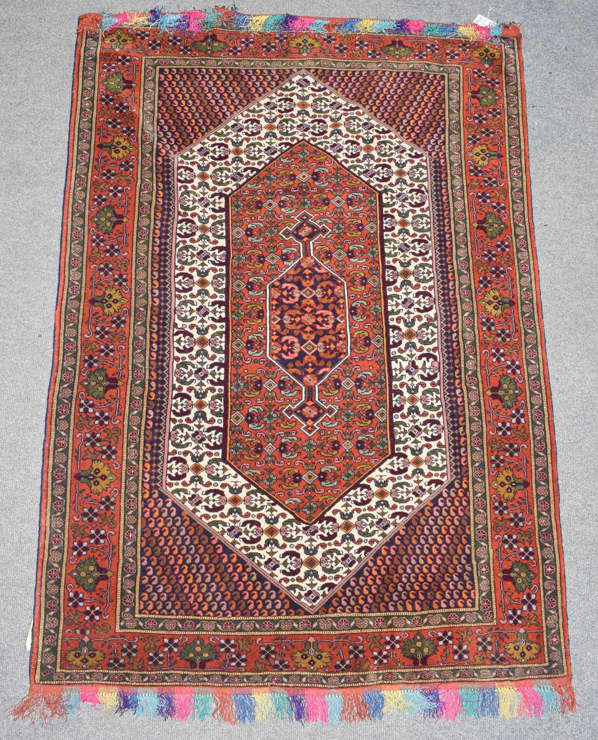 Lot 351 - Afghan rug, the ivory lozenge field with an...