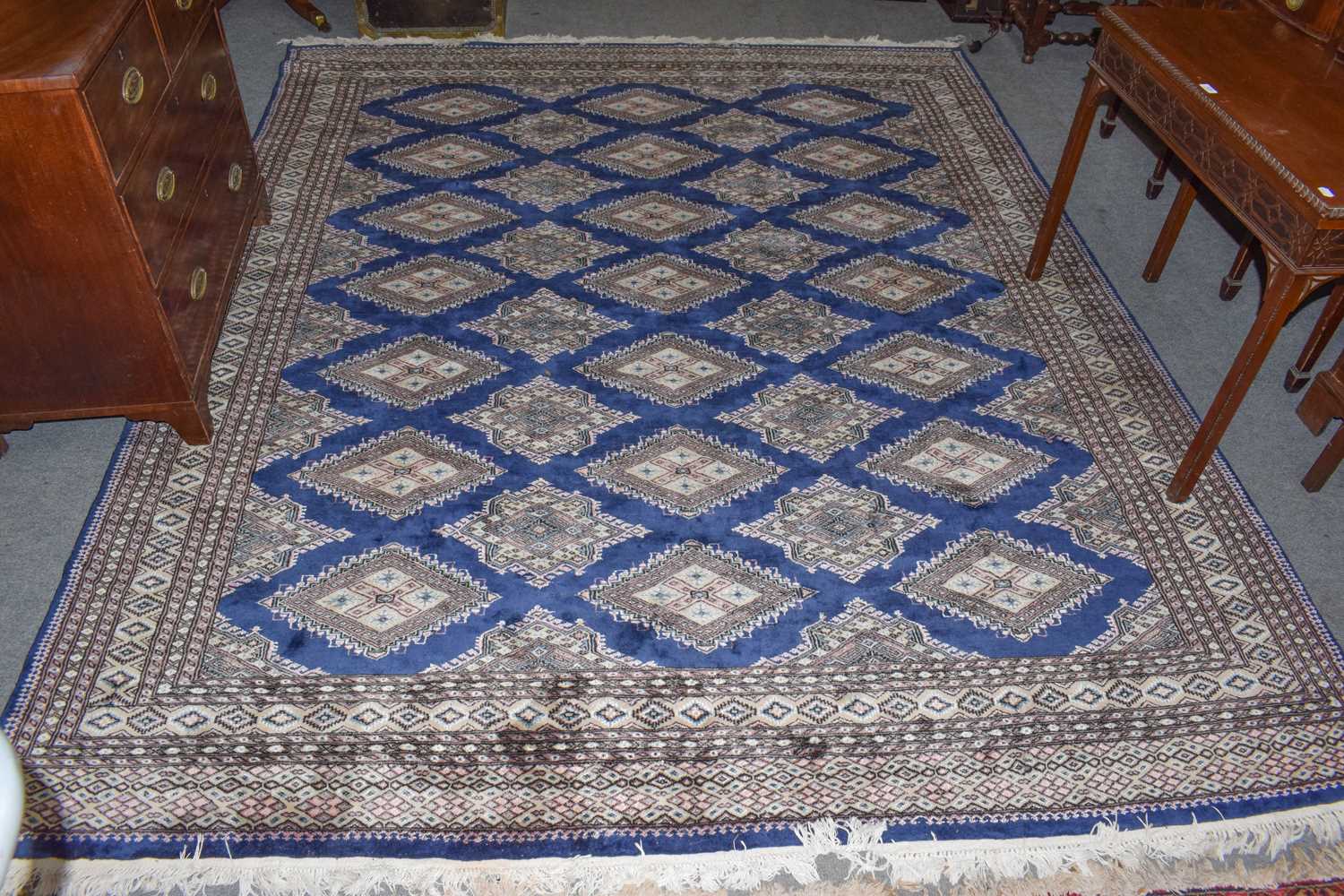 Lot 347 - Bukhara carpet, the indigo field of guls...