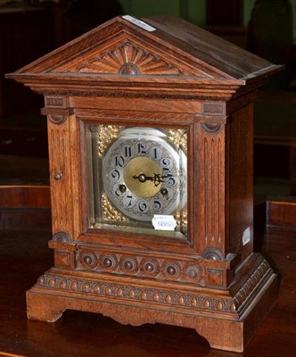 Lot 435 - An oak cased mantel clock