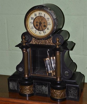 Lot 437 - A black slate and marble striking mantel clock