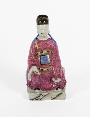 Lot 67 - A Chinese Porcelain Figure of a Seated...