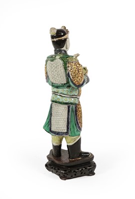 Lot 63 - A Chinse Porcelain Figure of a Warrior, Kangxi,...
