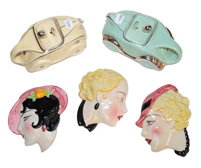 Lot 278 - Pair of Art Deco teapots and three masks