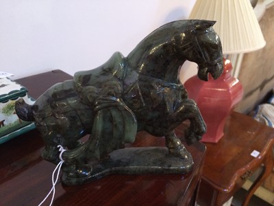 Lot 56 - A Chinese Spinach Jade Model of a Horse, in...