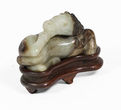 Lot 54 - A Chinese Celadon and Russet Jade Horse, Ming...