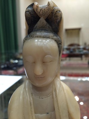 Lot 70 - A Chinese Soapstone Figure of Guanyin, Qing...