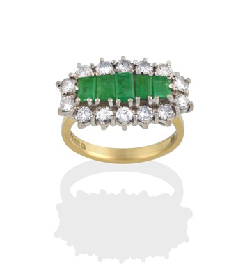 Lot 2325 - An 18 Carat Gold Emerald and Diamond Cluster Ring