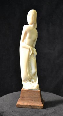 Lot 925 - A Scandinavian Carved Walrus Tusk Figure, circa 1920, modelled as Salome with the head of John...