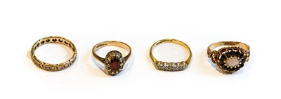 Lot 184 - A 9 carat gold opal and sapphire ring, finger...