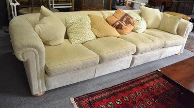 Lot 1110 - Two cream upholstered Duresta sofas, a...