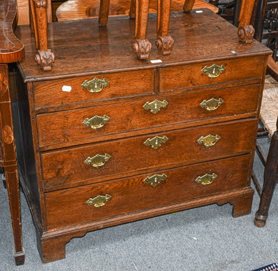 Lot 525 - An 18th century oak four height chest of...