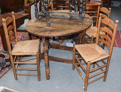 Lot 527 - An 18th century oak gateleg dining table,...