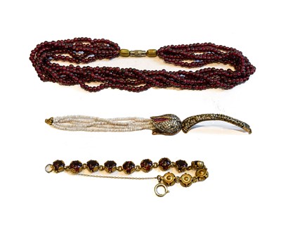 Lot 189 - A garnet five strand bead necklace, length...
