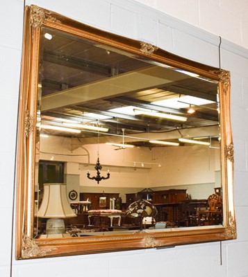 Lot 1127 - A large 20th century gilt framed wall mirror...