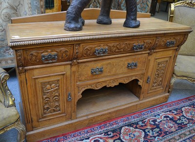 Lot 1067 - A late Victorian carved oak sideboard 174cm by...