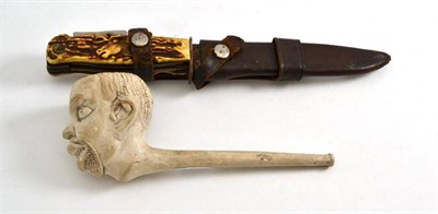 Lot 481 - Negro' clay pipe and a hunters knife