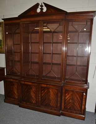 Lot 1105 - A large reproduction mahogany breakfront...