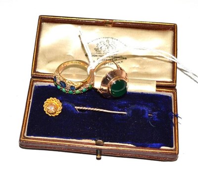 Lot 497 - Three stone-set rings and a cased tie pin