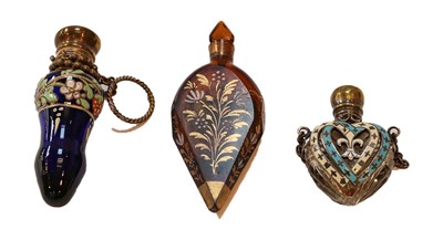 Lot 345 - Three scent bottles, one heart-shaped,...