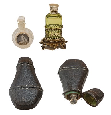 Lot 337 - Three scent bottles, comprising: a clear glass...