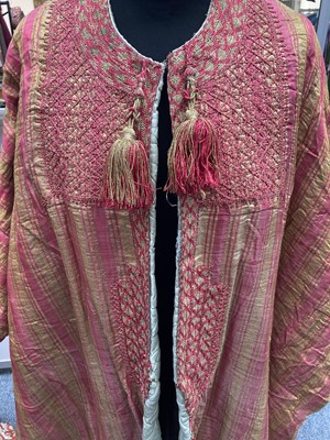 Lot 2187 - Late 19th Century Eastern Robe, of pink and...