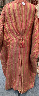Lot 2187 - Late 19th Century Eastern Robe, of pink and...