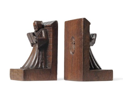 Lot 930 - A Pair of Robert  "Mouseman " Thompson Oak Bookends, carved as monks reading, leant against a wall