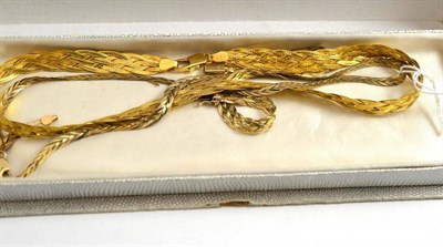 Lot 512 - A 9ct gold entwined necklace and a necklace and bracelet