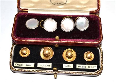 Lot 516 - A cased set of four mother-of-pearl studs stamped '18CT & PLAT' and a 9ct gold set of studs