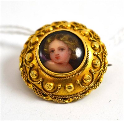 Lot 523 - A portrait miniature brooch, with locket back enclosing hair, inscribed to the reverse 'Harry R...