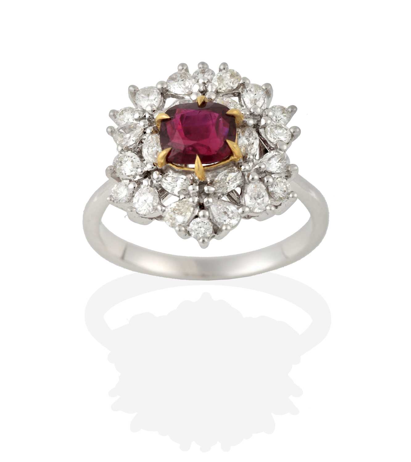 Lot 2284 - A Ruby and Diamond Cluster Ring, the cushion...