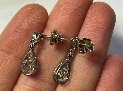 Lot 2289 - A Pair of Diamond Drop Earrings, the pear...