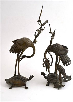 Lot 538 - Two Japanese bronze pricket candlesticks modelled as Tsuru & Kame (two symbols of longevity)