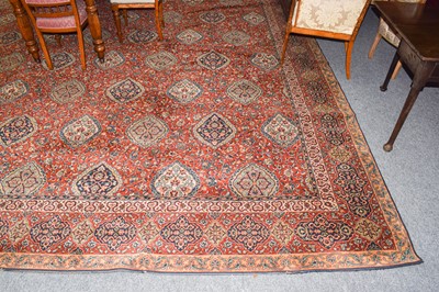 Lot 1003 - A machine made carpet of oriental design, the...