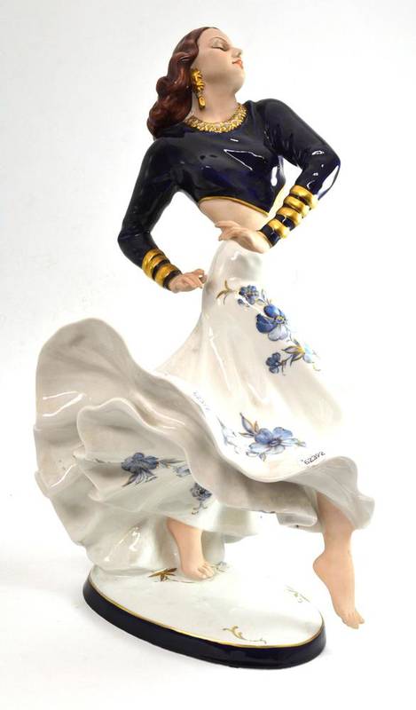 Lot 560 - A Royal Dux figure of a dancer, with a swirling skirt in blue and gilt, factory marks, 58cm