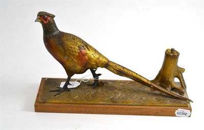 Lot 564 - A cold painted spelter Strike-Lite table lighter, in the form of a pheasant, on an oak plinth base