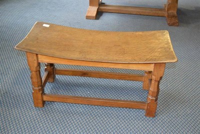 Lot 936 - A Robert  "Mouseman " Thompson Oak Double Dish Stool, on four octagonal legs joined by rails,...