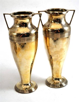 Lot 569 - A pair of silver twin handled vases, Chester 1923